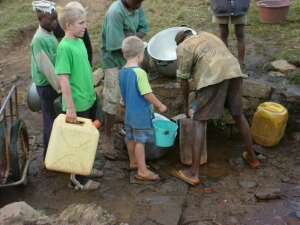 Boys collecting water